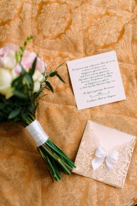 wedding card and a bouquet of flower